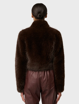 Elegant cropped jacket made of walnut faux fur, offering a luxurious feel and trendy silhouette for any casual ensemble.