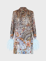 Mini shirt dress with luxe feathers, inspired by flamenco art, featuring a fluid design and intricate embellishments.