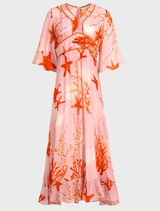 Stylish pink shell dress with a bold fire design, ideal for making a memorable impression at gatherings.