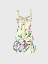 Fitted short dress with sweetheart neckline, topstitching, and Chinoiserie print in butter yellow, magenta, and mauve.