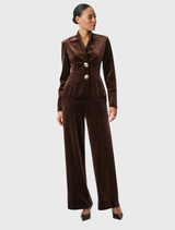 Mahogany velvet blazer with a fitted cut, long sleeves, stand collar, and two-button closure; designed without lining.