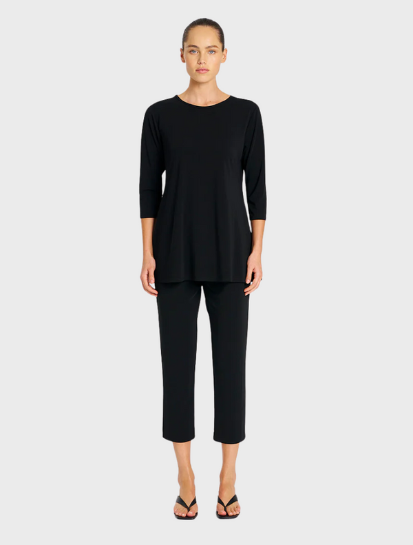  Black top and pants made from soft, stretchy fabric, ideal for comfort and ease of movement.