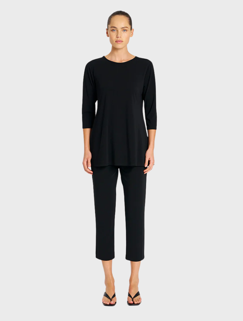  Black top and pants made from soft, stretchy fabric, ideal for comfort and ease of movement.