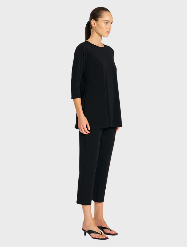 Soft, stretchy black top and pants, designed for comfort and flexibility in wear.