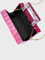 Handbag in pink and purple hues, equipped with a chain strap and Fleur Acrylic top handle.