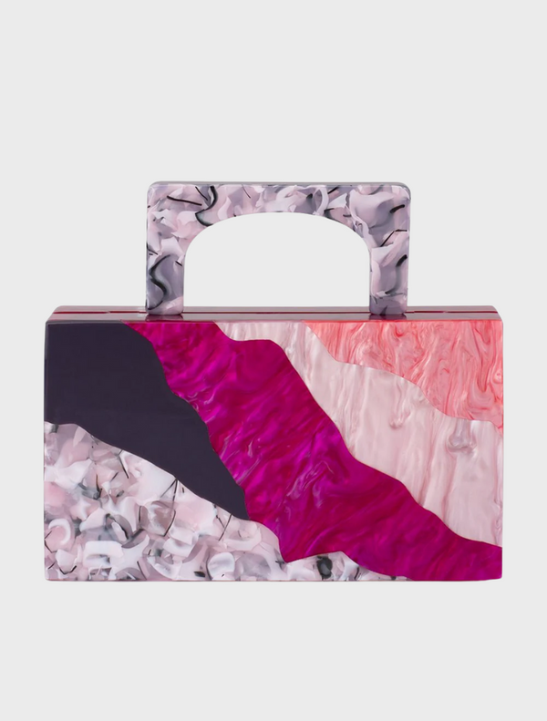 Pink and black handbag with a stylish design, featuring a Fleur Acrylic top handle.