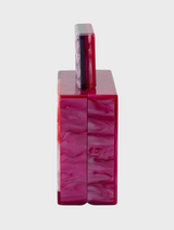 Stylish pink and purple handbag with a chain strap, designed with a Fleur Acrylic top handle.
