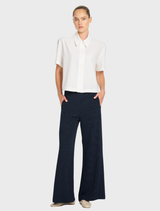 Chalk Flex Weave Crop Shirt featuring a classic collar and button front, designed from a smooth matte twill weave fabric.