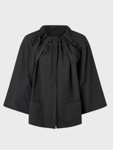 A black flip jacket made from lightweight, stretchy fabric, showcasing a modern design suitable for various occasions.
