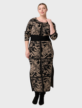 Elegant floral knit dress made from a merino wool blend, adorned with a lively flora deco print for a chic look.
