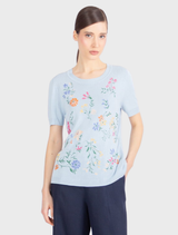 Sky blue pullover with short sleeves, adorned with intricate floral embroidery, made from soft, breathable pure viscose.