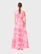 Asymmetrical pink floral maxi gown featured on a mannequin, emphasizing its chic style and vibrant floral print.