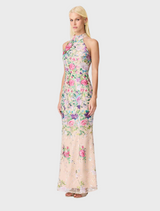 A graceful floral gown constructed from a vivid floral print fabric, reflecting a charming and elegant aesthetic.