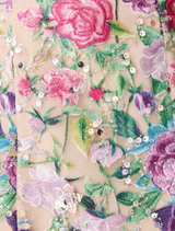 A stylish floral gown made from a delicate floral print fabric, emphasizing its beautiful patterns and colors.
