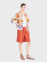 Floral-patterned bomber jacket in white and coffee, knitted from pure cotton, combining sporty style with artistic flair.
