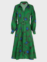 Elegant green floral dress designed for winter, showcasing a fitted silhouette and a graceful, flowing skirt.