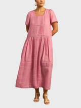 The Skyscape Dress displays a beautiful sky-themed pattern in vivid blue and pink hues, ideal for casual wear.
