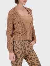 Chic biscotti blouse featuring beautiful flower appliqués, ideal for enhancing a casual or semi-formal wardrobe.