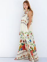 Gabi Dress adorned with colorful flowers, highlighting a stylish and graceful look suitable for various occasions.