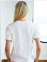 White T-shirt with a decorative foil print, representing the Foil & Flourish style.