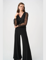Wide leg jumpsuit in black offering a stylish and relaxed fit for versatile wear.