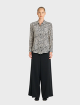 A fossil-colored soft shirt laid flat, highlighting its smooth texture and relaxed fit.