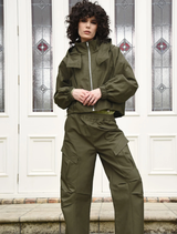 Khaki found objects pant displayed on a neutral background, showcasing its unique texture and design.