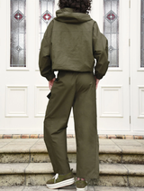 Khaki found objects pant featured on a plain surface, emphasizing its casual style and material.
