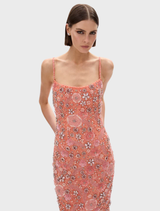 Francesca's peach flower gown, highlighting intricate floral details and a graceful silhouette, presented on a mannequin.