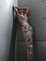 The Rosewater Francesca Gown showcases a sculptural corset, intricate details, and a striking silhouette for special occasions.