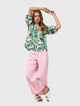 Printed linen top with a V-neck, neru collar, contrast piping, and small tucks at the front neckline.
