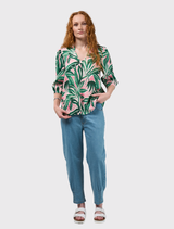 V-neck linen top with neru collar, contrast piping, and small tucks at the neckline in an emerald multi print.