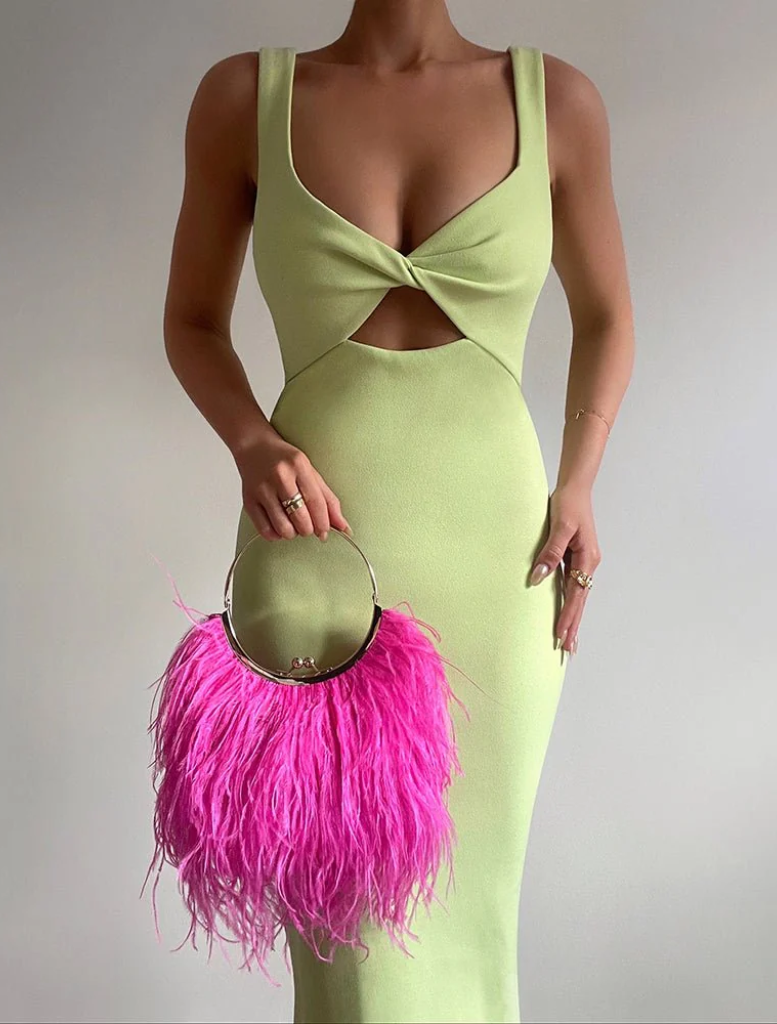 A stylish pink feather purse adorned with a metal ring, perfect for adding flair to any outfit.