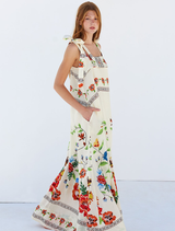 Gabi Dress displaying a lively flower pattern, perfect for adding a touch of charm and sophistication to outfits.