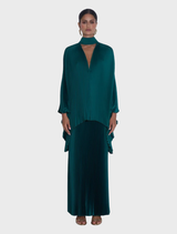 The Pine Gala Skirt showcases luxurious high-shine pleats that flow from the waist, reflecting a romantic, vintage aesthetic.