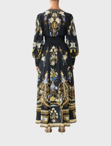 Ottoman-style dress featuring a fitted waistband and stylish gathered sleeves for a sophisticated look.