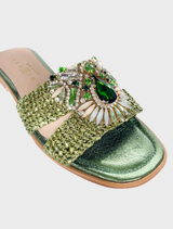 A green Gemma V garment, featuring a chic design that highlights its modern style and rich color.