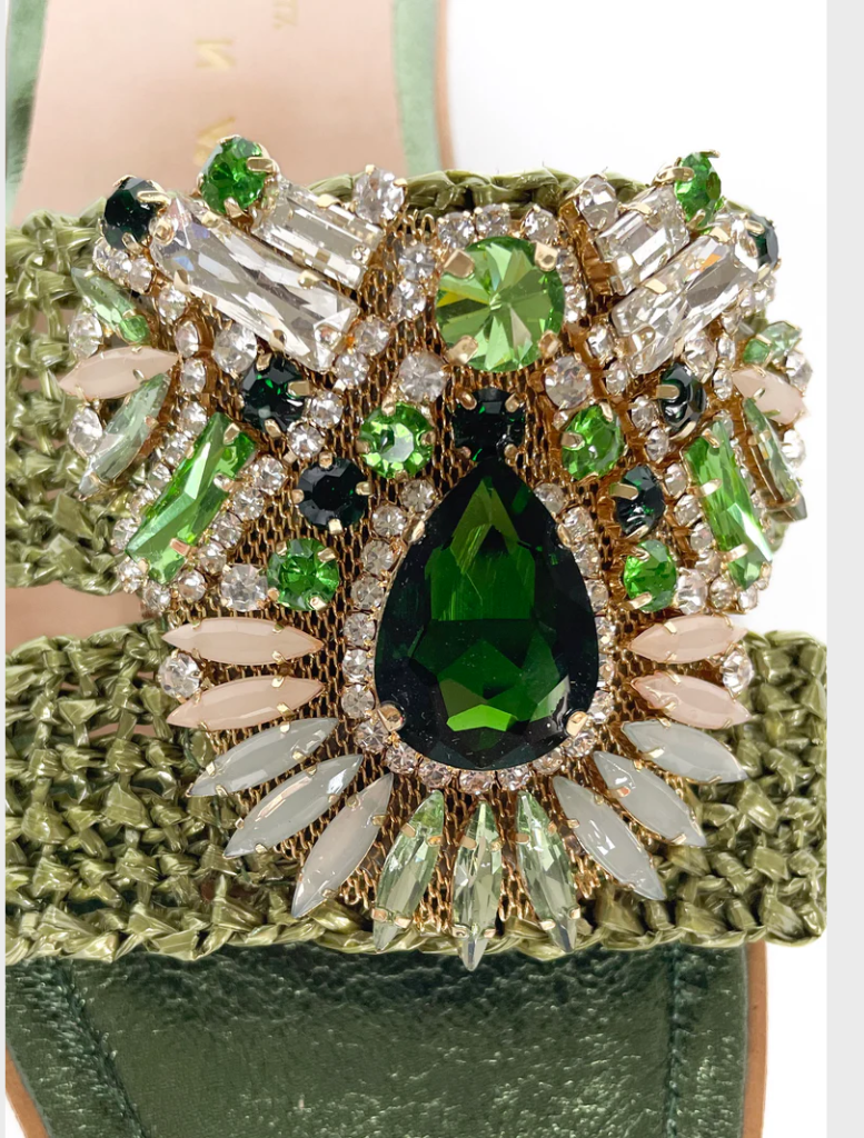 A green Gemma V piece, characterized by its elegant style and vibrant shade, perfect for a fashionable wardrobe.