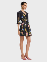 Stylish mini dress in ebony, decorated with a lemon vine print and featuring sophisticated sleeves for a trendy outfit.