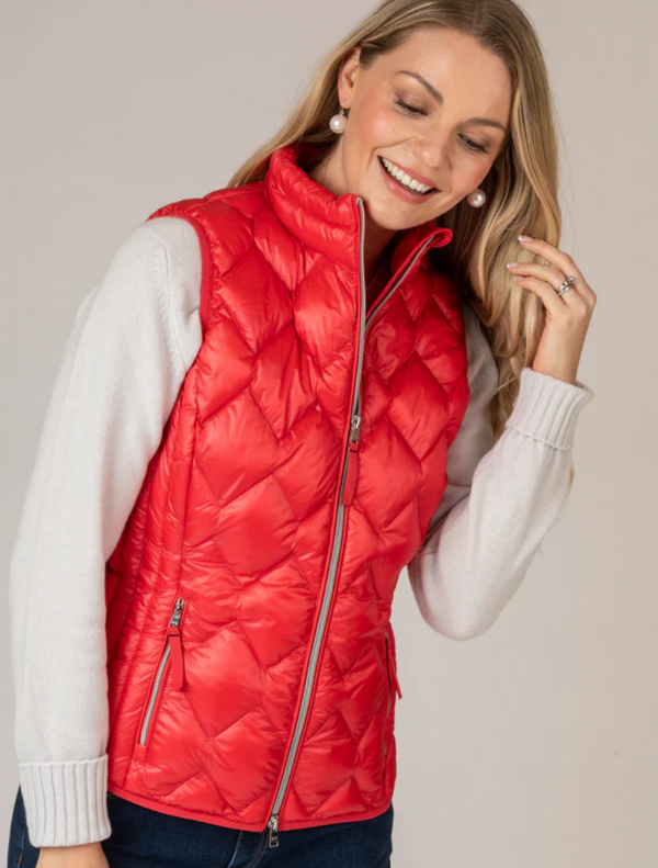 Lightweight women's red puffy vest, designed for breathability and comfort, perfect for outdoor activities.