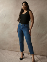 Classic slim fit jeans in medium blue by Gia, offering a chic silhouette and made from soft, sculpting Featherweave denim.