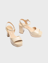 Giardino women's nude leather sandal with a wide block heel offering a chic and comfortable footwear option.
