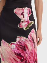 Garnet Magnolia Gifford Maxi Dress, characterized by its flowing style and vibrant garnet color with floral embellishments.