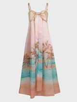  A sunset-inspired dress with a decorative bow at the waist, combining elegance and contemporary fashion.