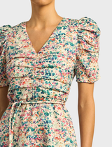 The Glimmer Dress features a unique marble pattern, offering a chic and elegant style suitable for special events.