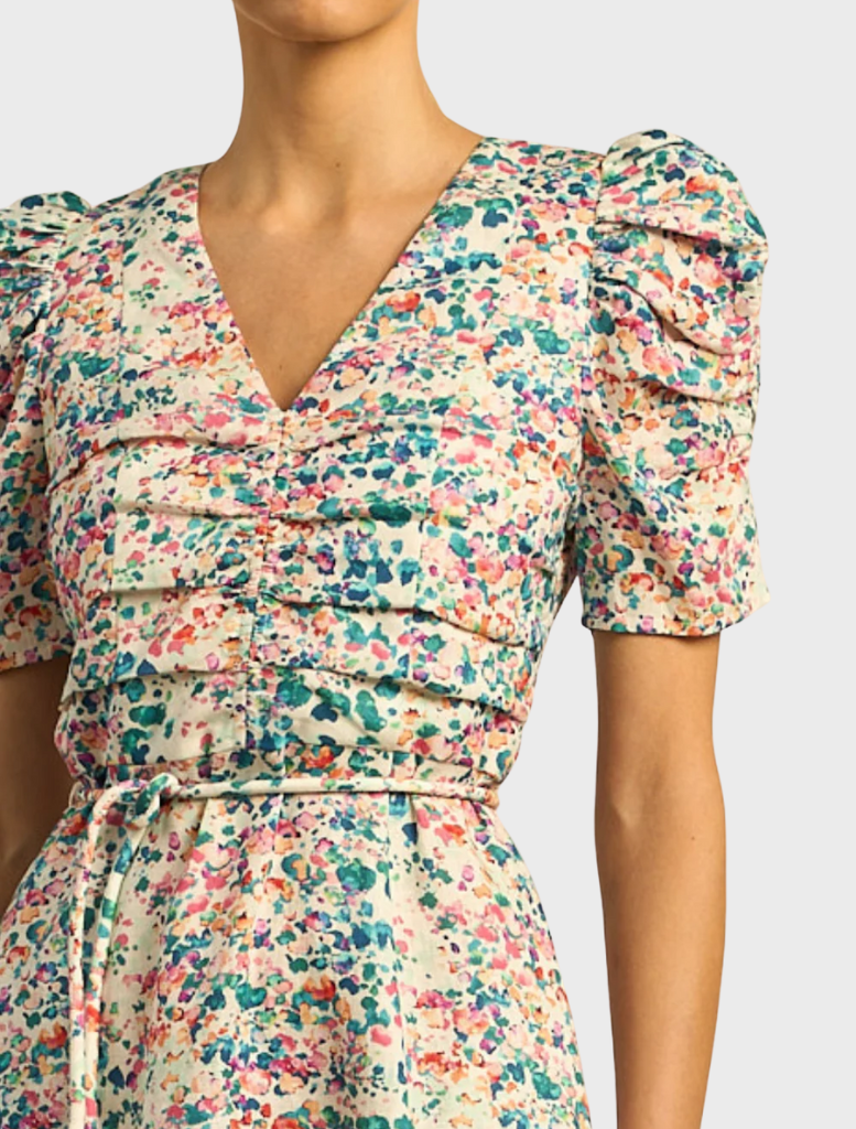 The Glimmer Dress features a unique marble pattern, offering a chic and elegant style suitable for special events.