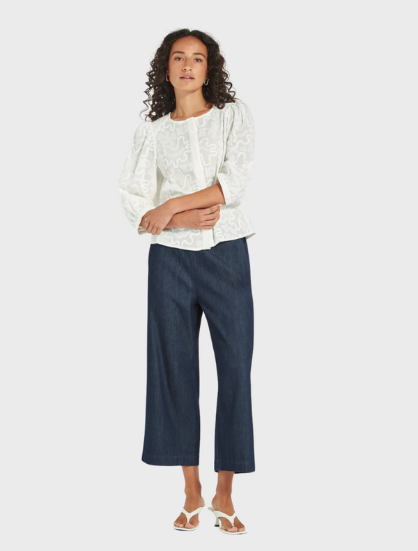 Cropped wide leg denim pants displayed, showcasing their casual and stylish design.