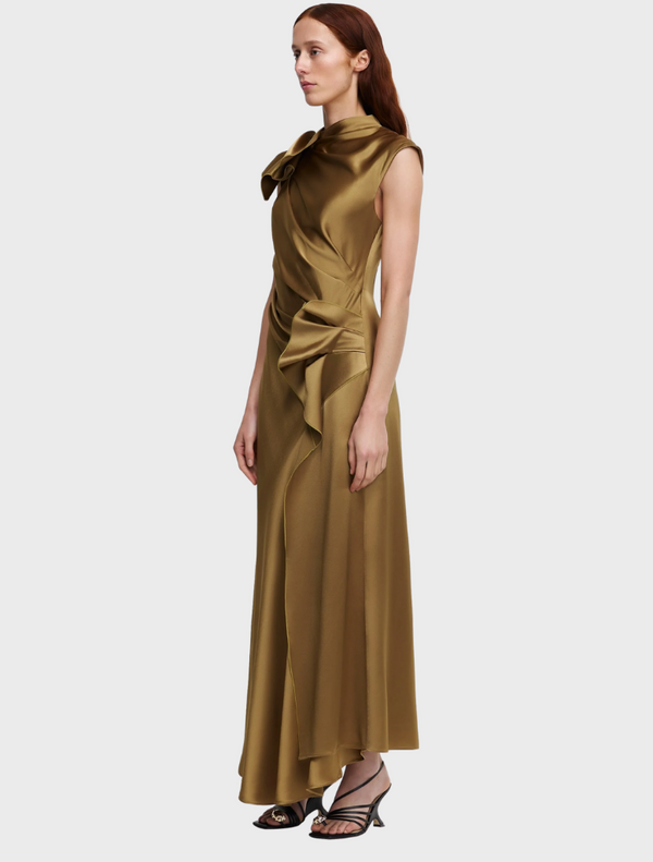 A chic gold dress made of silk, complete with a decorative bow at the neck, perfect for formal occasions.