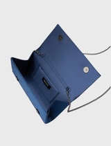 Classic navy clutch with crystal detailing, magnetic closure, and room for essentials; includes a shoulder chain for convenience.