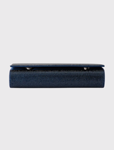 Classic navy envelope clutch with crystal hotfix, magnetic closure, and detachable chain, designed for stylish convenience.